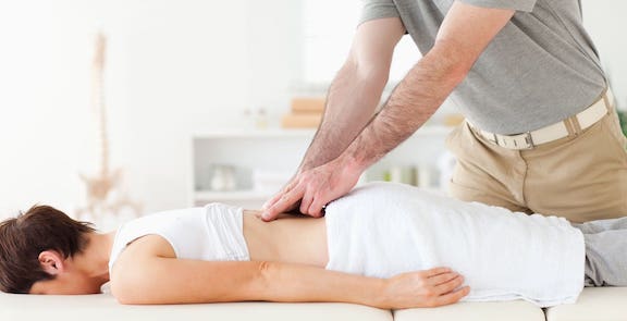 Woman receiving chiropractic care