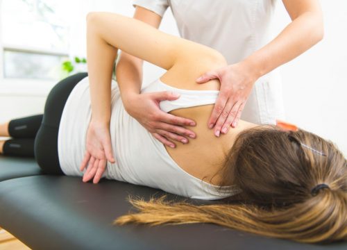 Woman receiving chiropractic services