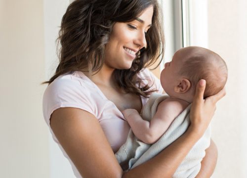 Young mom holding her baby