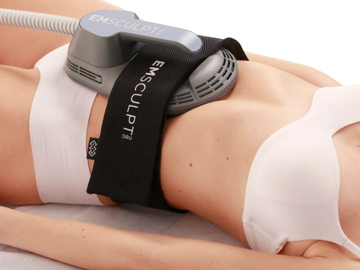 Woman receiving Emsculpt NEO treatments