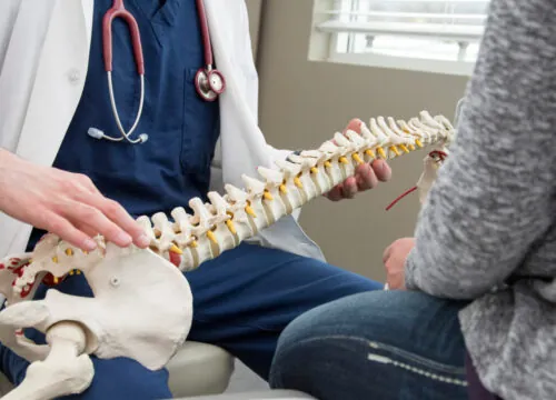 Photo of a chiropractor with a patient